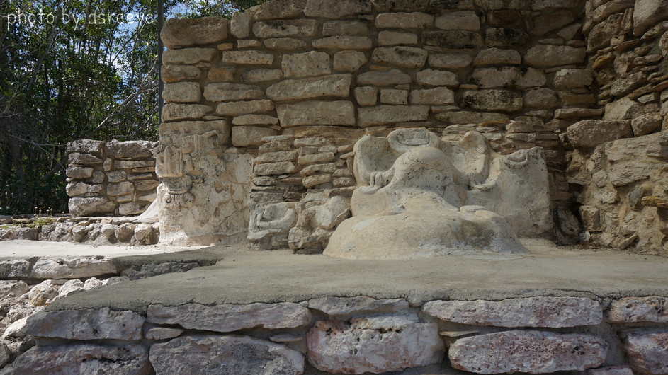 Sculptures molded onto the surface of a pyramid.