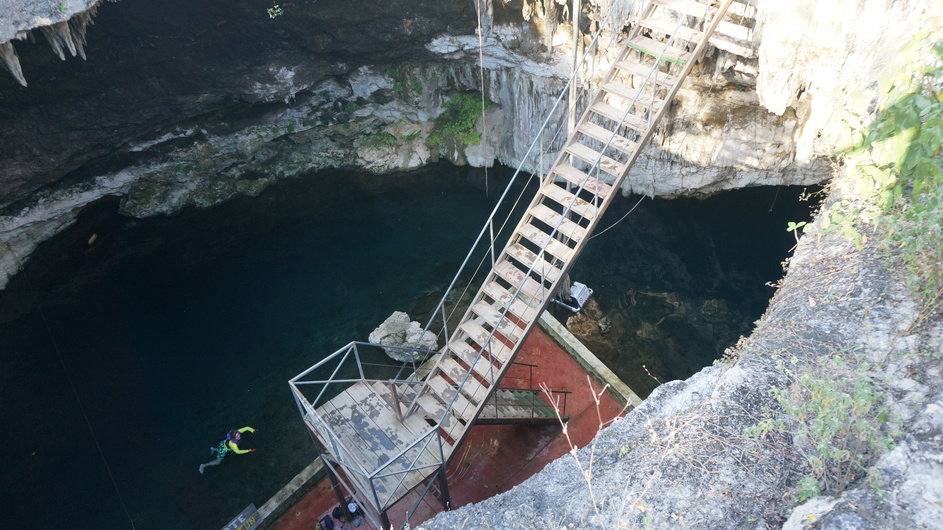 Water in cenote with geochemical station nest to the roots descending into the water